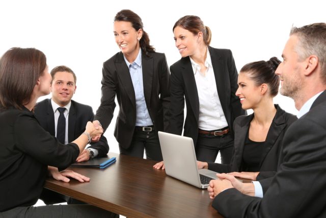 persons-in-suits-around-a-conference-table