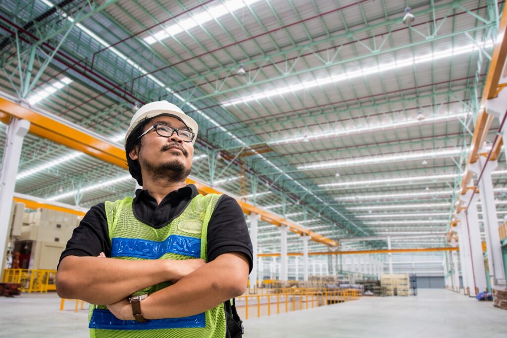 man-in-PPE-standing-in-warehouse